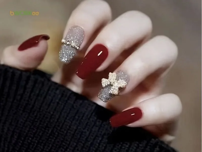 Mẫu nail đỏ đính nơ đá sang chảnh